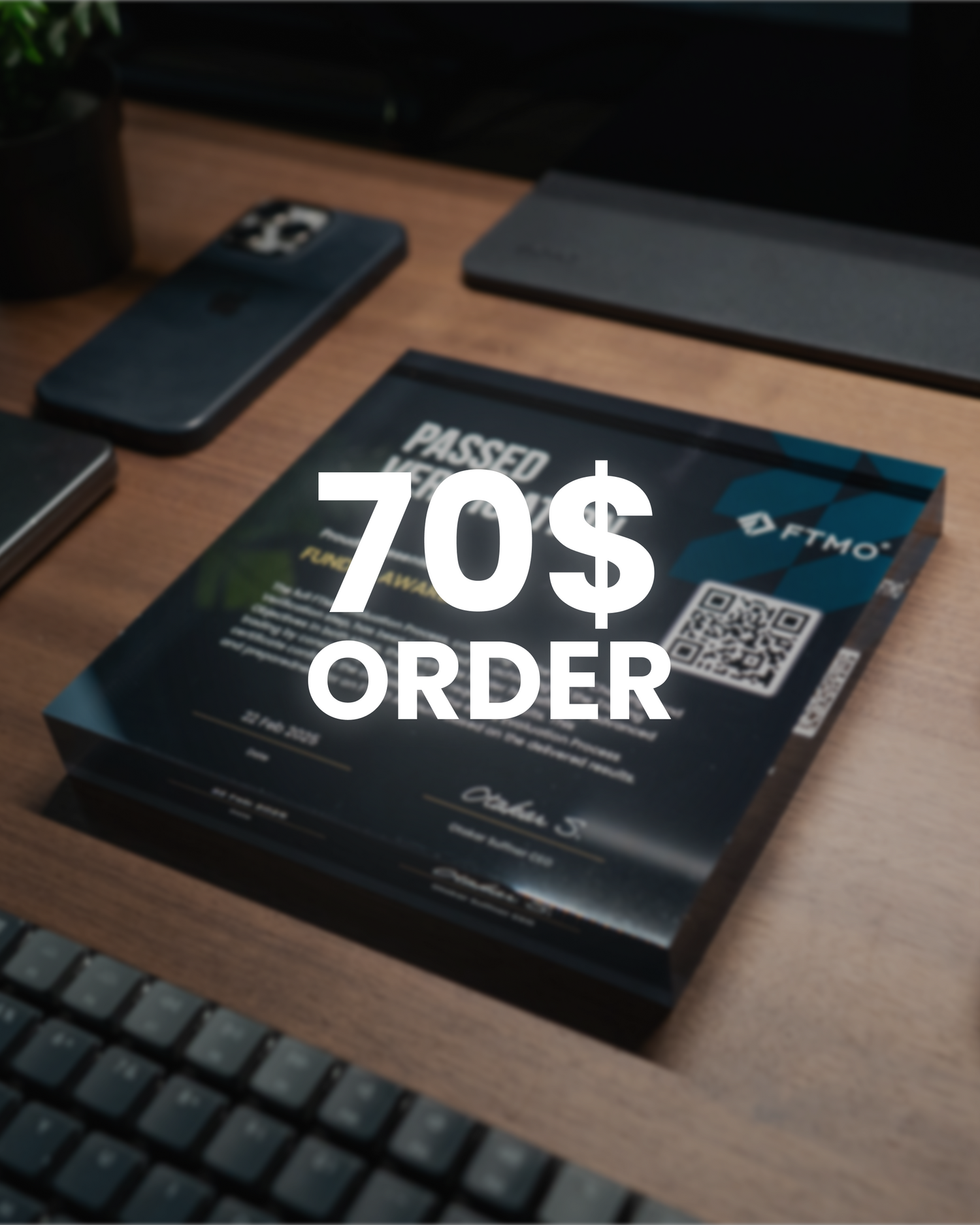 Product packaging on a desk with '70$ ORDER' discount for propfirm challenge text overlay